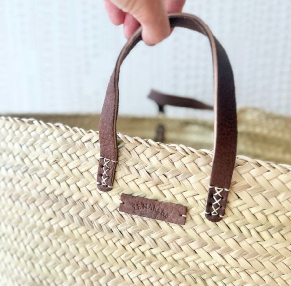 Le Marche XL Classic tan market basket shown outdoors