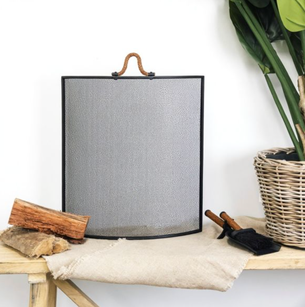 Front view of black leather handle fire screen