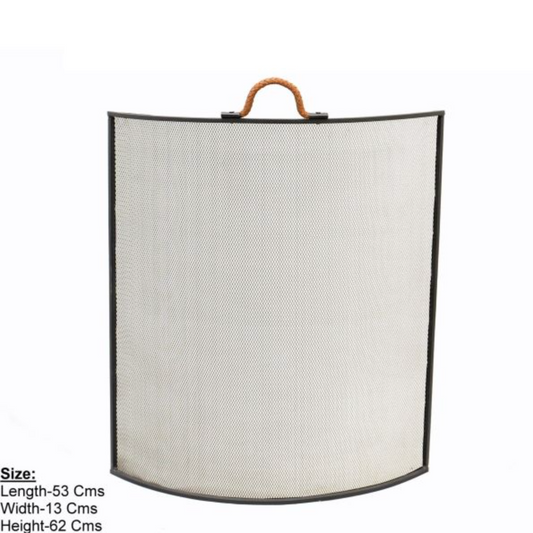 Leather handle fire screen styled beside a fireplace