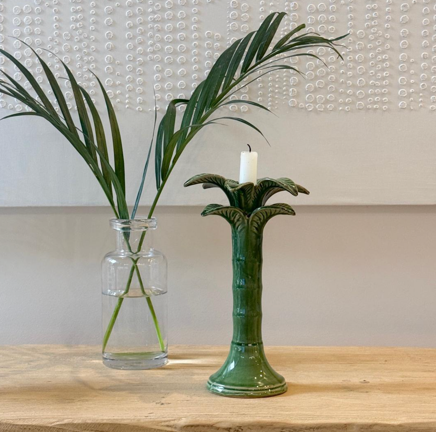 Green palm-shaped candlestick with layered leaves