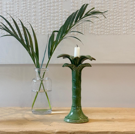 Green palm-shaped candlestick with layered leaves