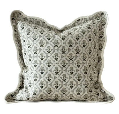 Sage print square scalloped edge cushion with feather insert on a white background