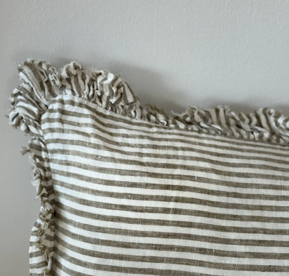 Close-up of the olive striped linen fabric and ruffled edge on a bolster cushion cover