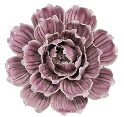 Back of a mauve ceramic flower sculpture showing the hanging slot.