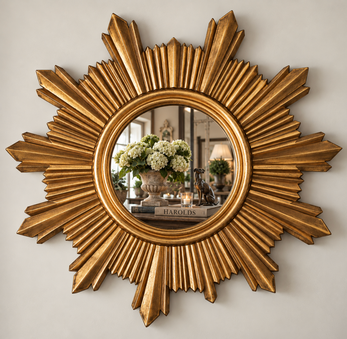Gold traditional sunburst mirror with radiating rays and a round central mirror