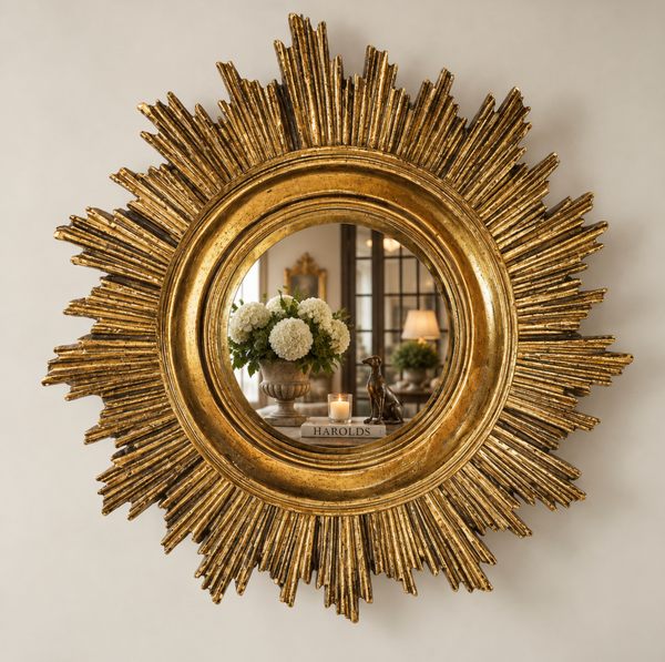 Small gold sunburst mirror with a painted timber frame and round central mirror