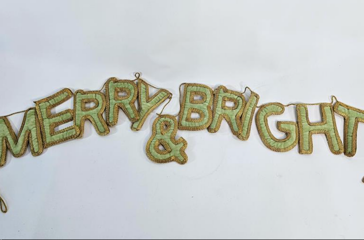 Mint green velvet garland spelling Merry and Bright with gold edging