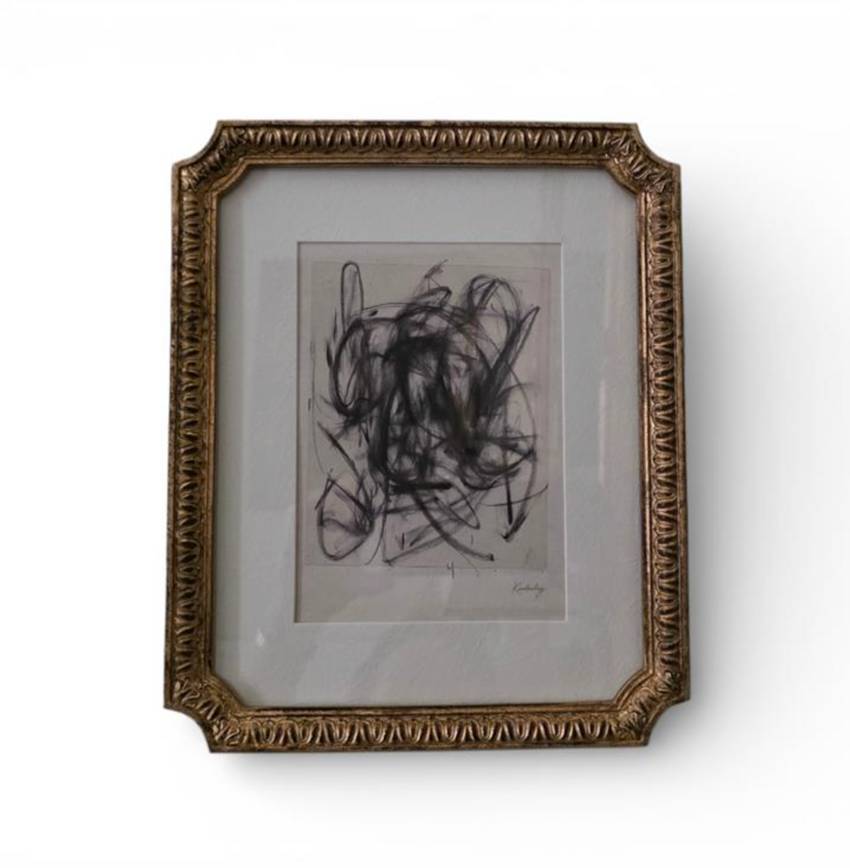 Ornate brown and gold-toned frame holding an abstract monochrome artwork