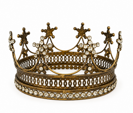 Large aged gold-toned crown with pointed crest details and clear faceted embellishments