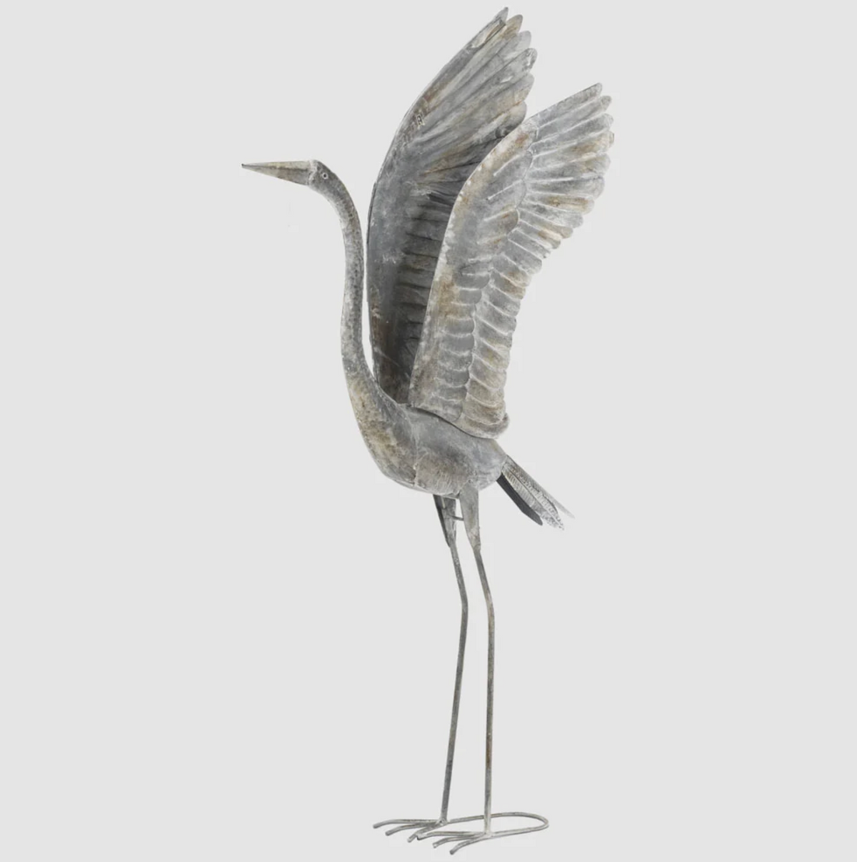Large iron crane statue with raised wings