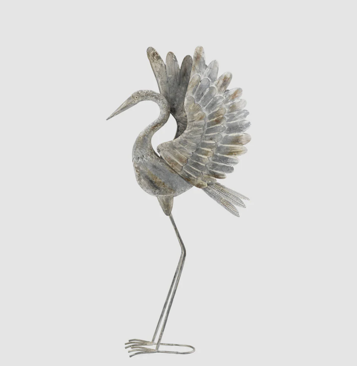 Small iron crane statue with raised wings