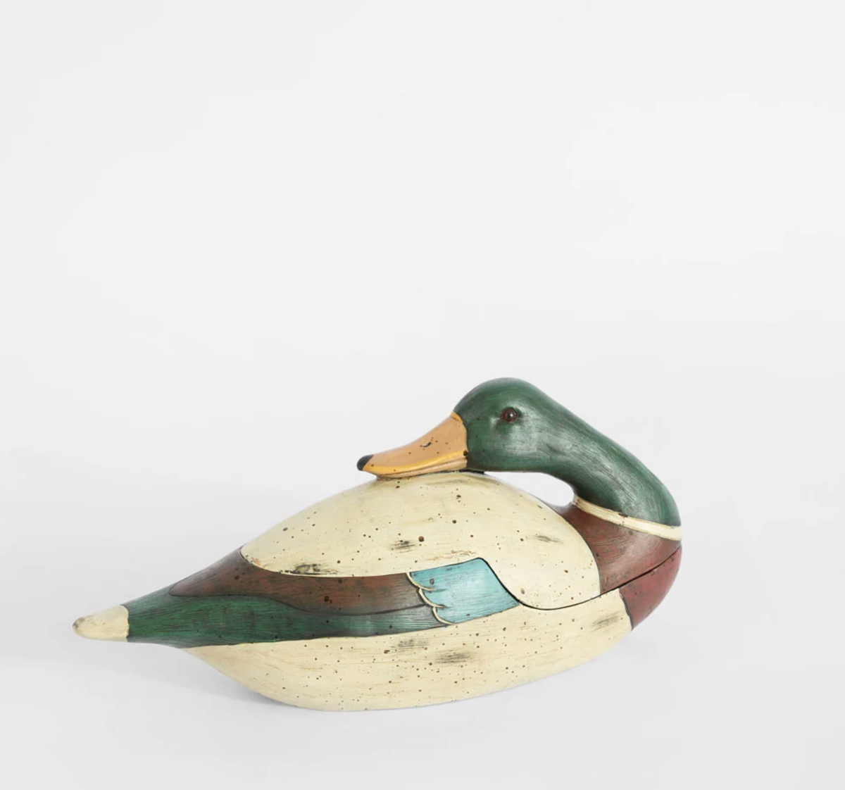 Green duck trinket box shown open with storage compartment visible