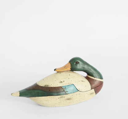 Green duck trinket box shown open with storage compartment visible