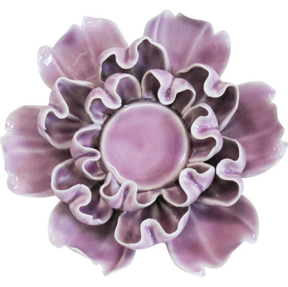 Top view of a mauve ceramic flower-petal tealight holder