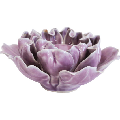 Side view of a mauve ceramic flower-petal tealight holder