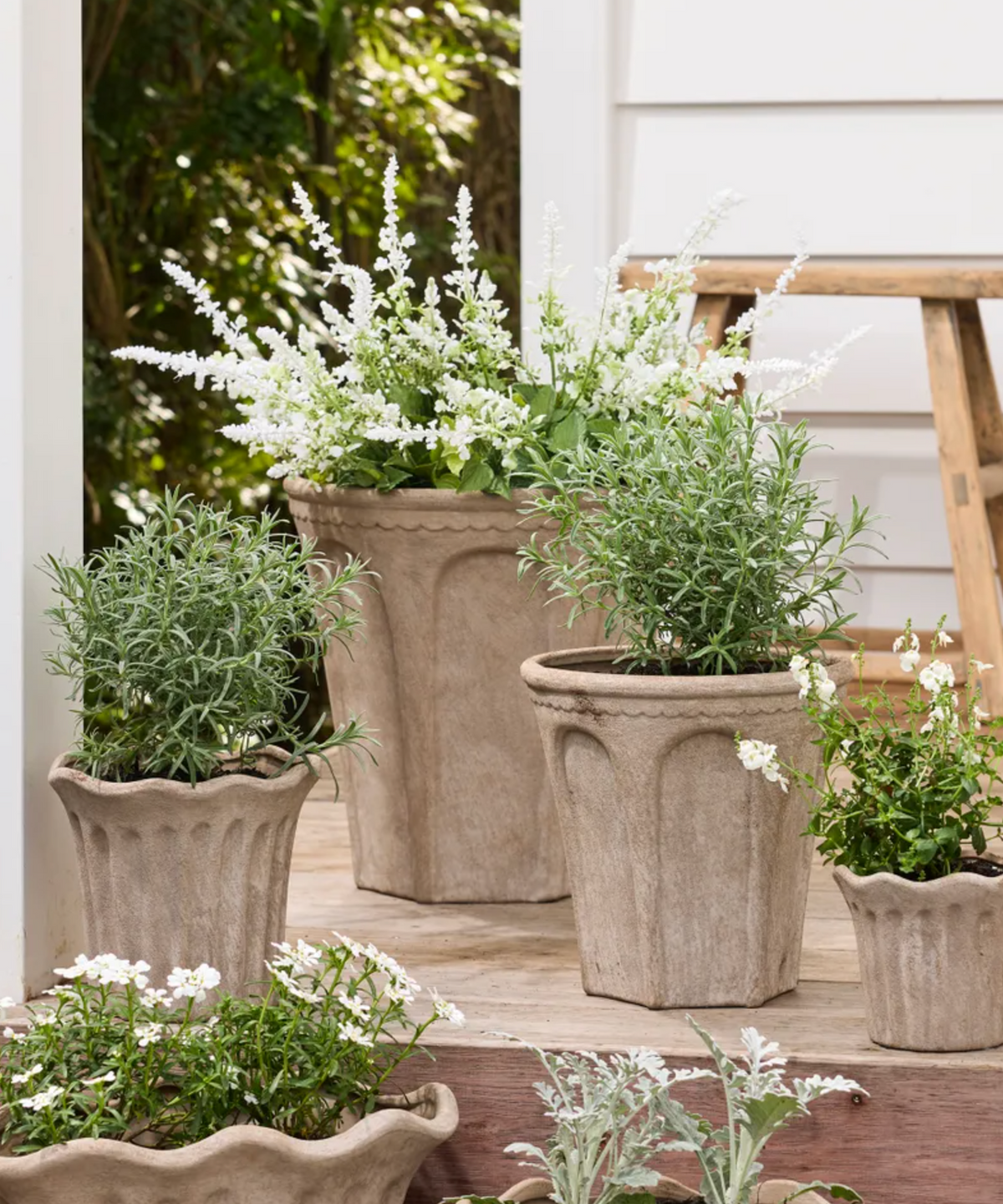 Large Sand Terra Arc Planter in terracotta with sculpted panels.