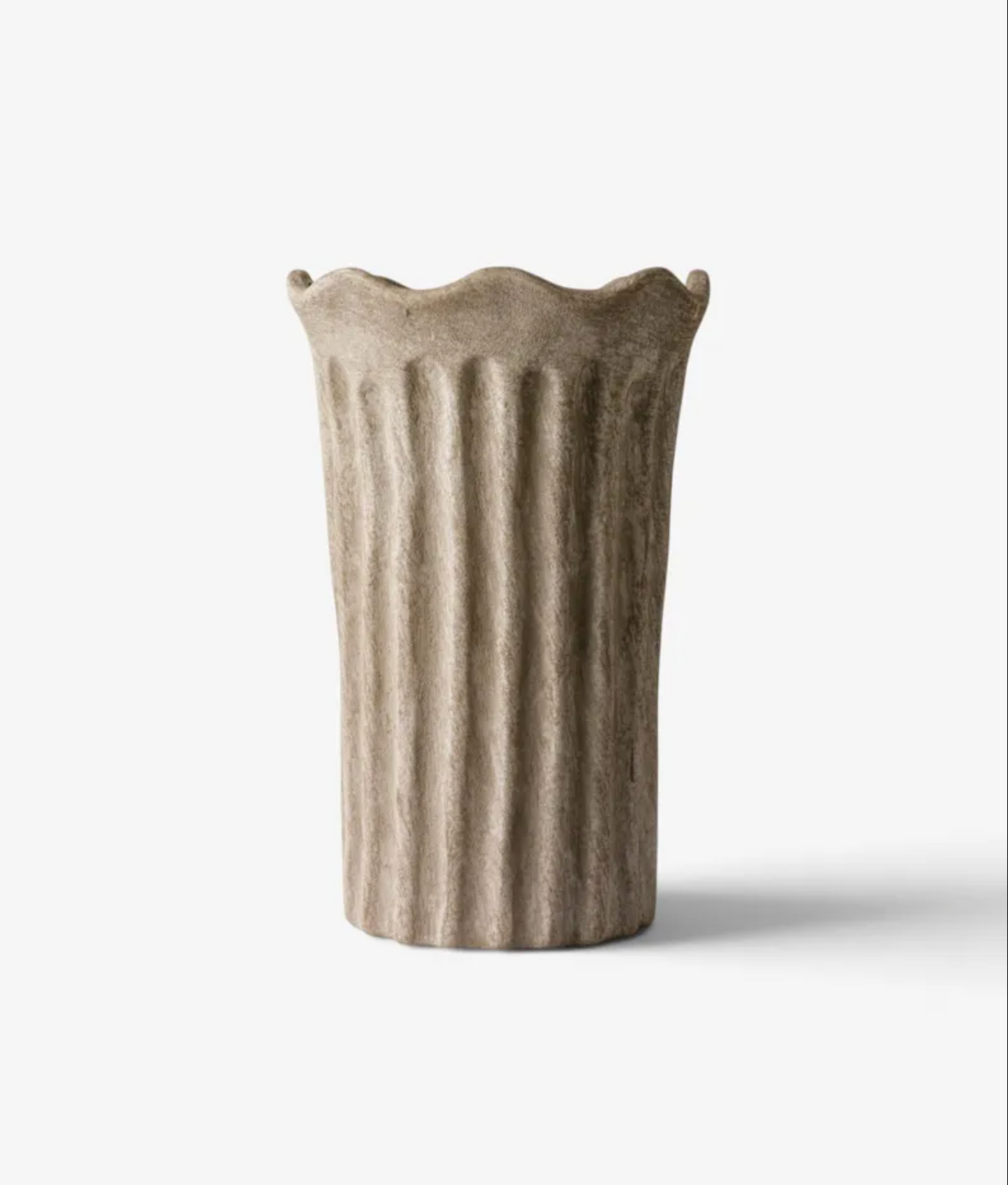 Fluted Vase in sand terracotta with sculpted panels on a white background