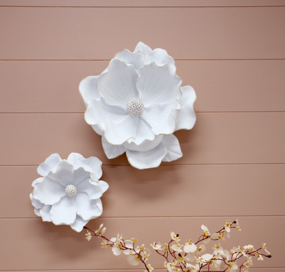 Back of white resin magnolia flower sculpture with wall-mount fittings