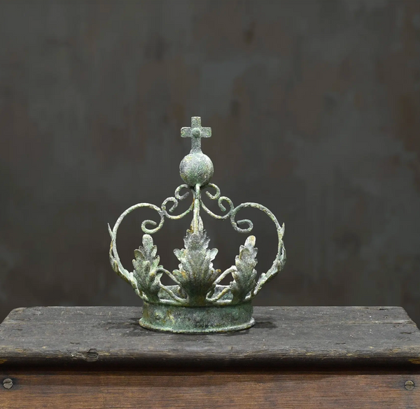 Close-up of crown cross and tin leaves