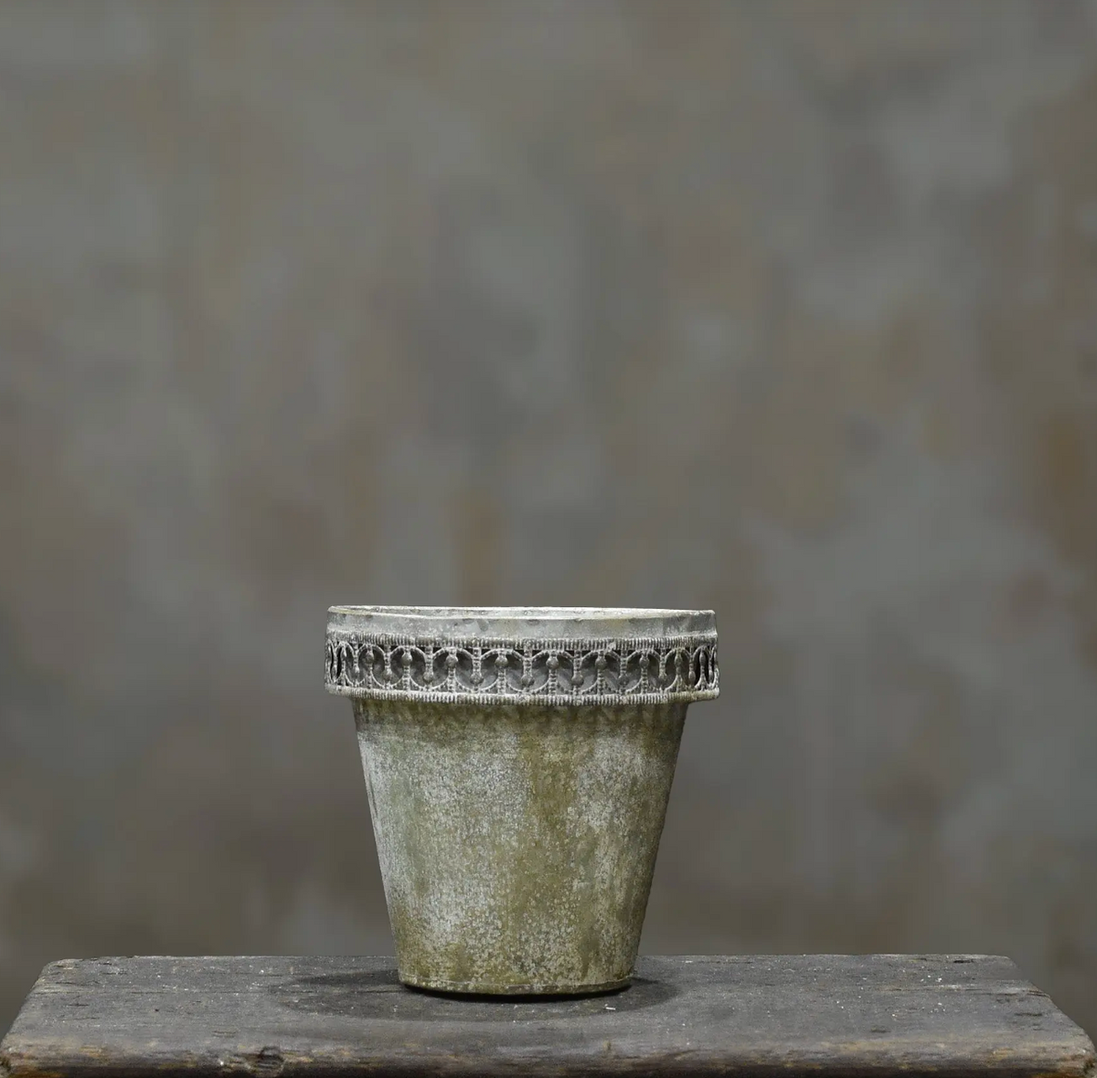 Three tin flower pots in different sizes