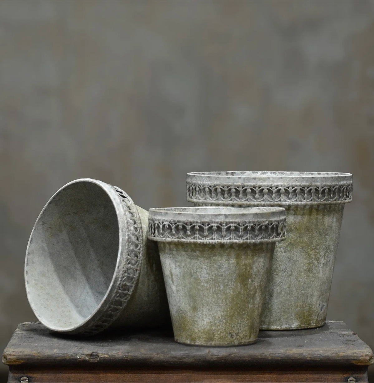 Tin flower pot with weathered patina, front view