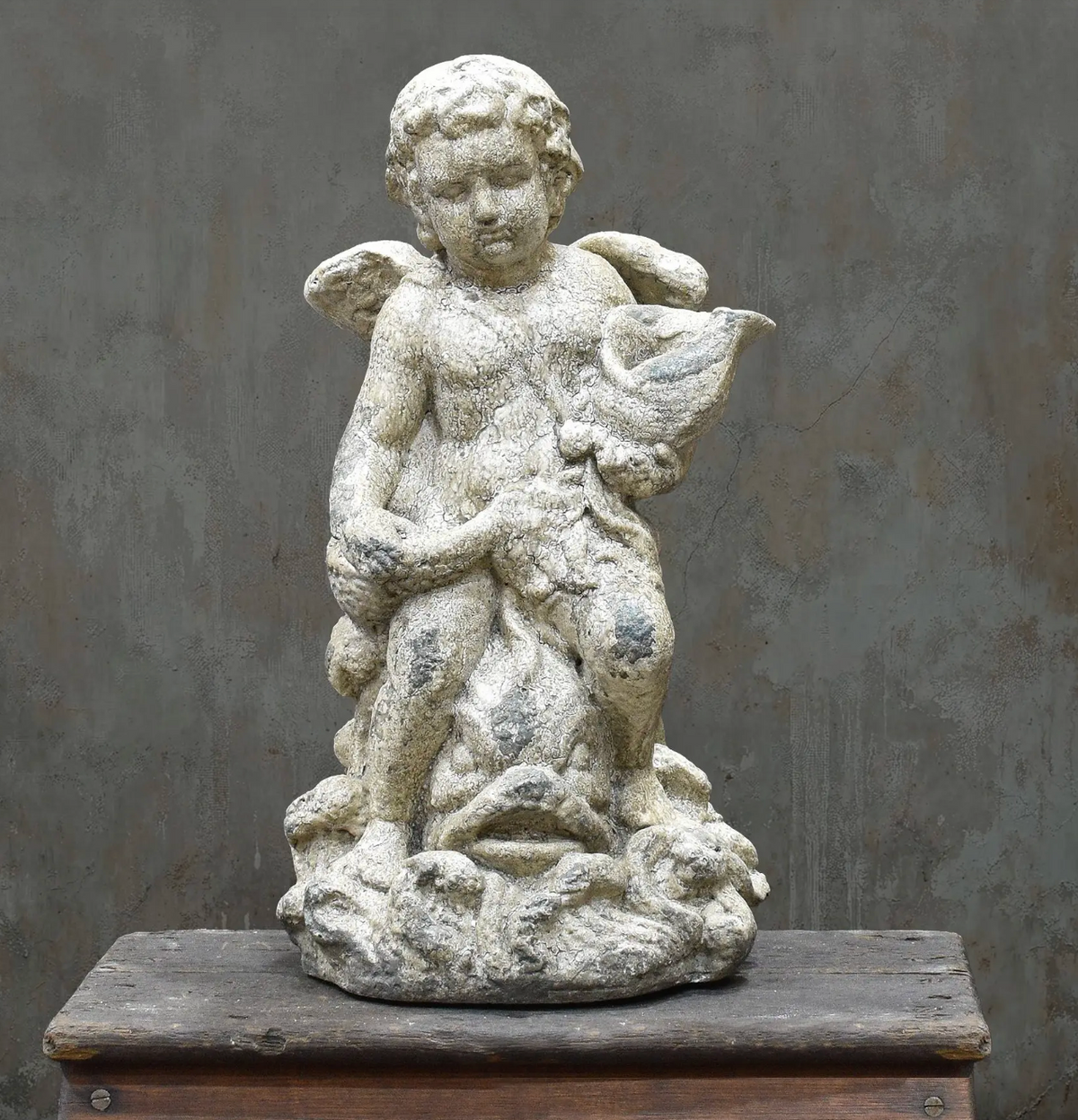 Standing cherub statue, front view