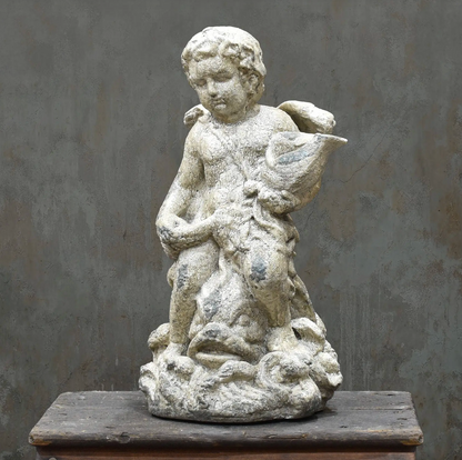Standing cherub statue, back view