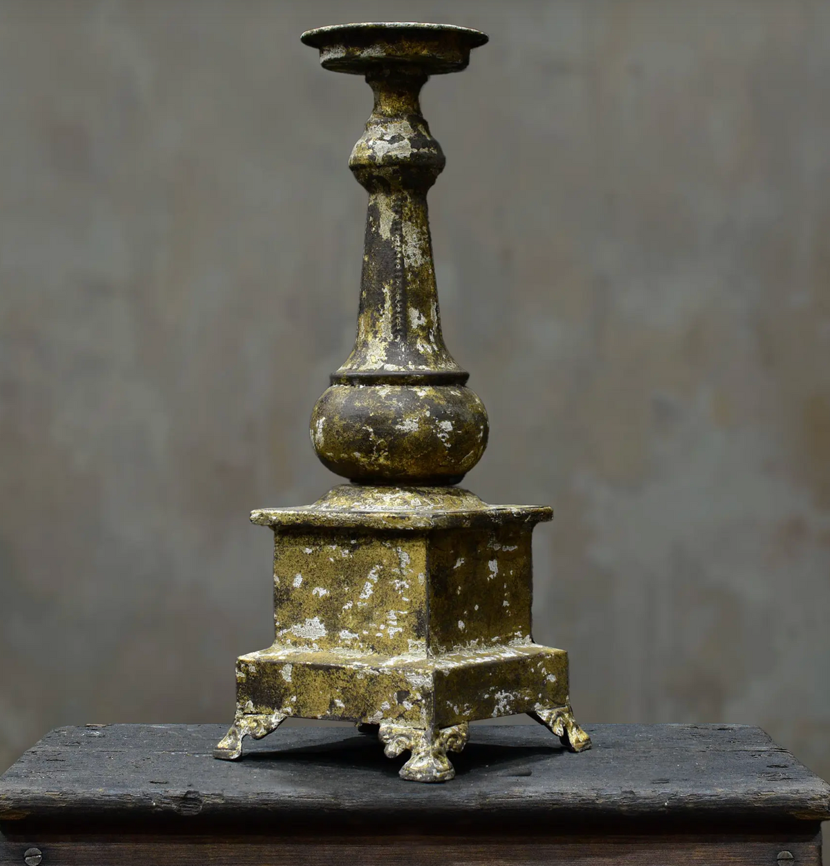 Close-up of gold candlestick candle dish and stem