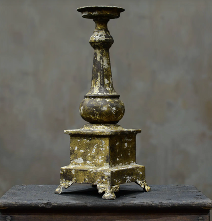 Close-up of gold candlestick candle dish and stem