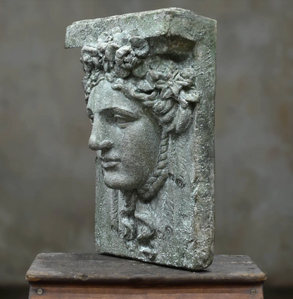 Close-up of Hermes wall plaque surface and relief