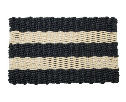Black and cream striped rope door mat placed at a doorway