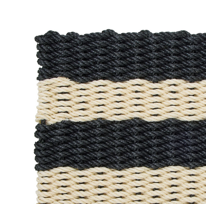 Close-up of the black and cream striped rope door mat weave