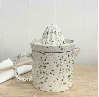 White juicer set with green speckles, reamer fitted over handled pouring jug