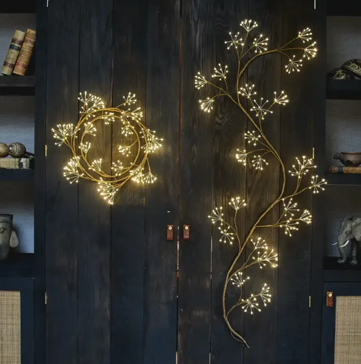 Ivy-inspired branching lights displayed coiled and extended against dark cupboard doors