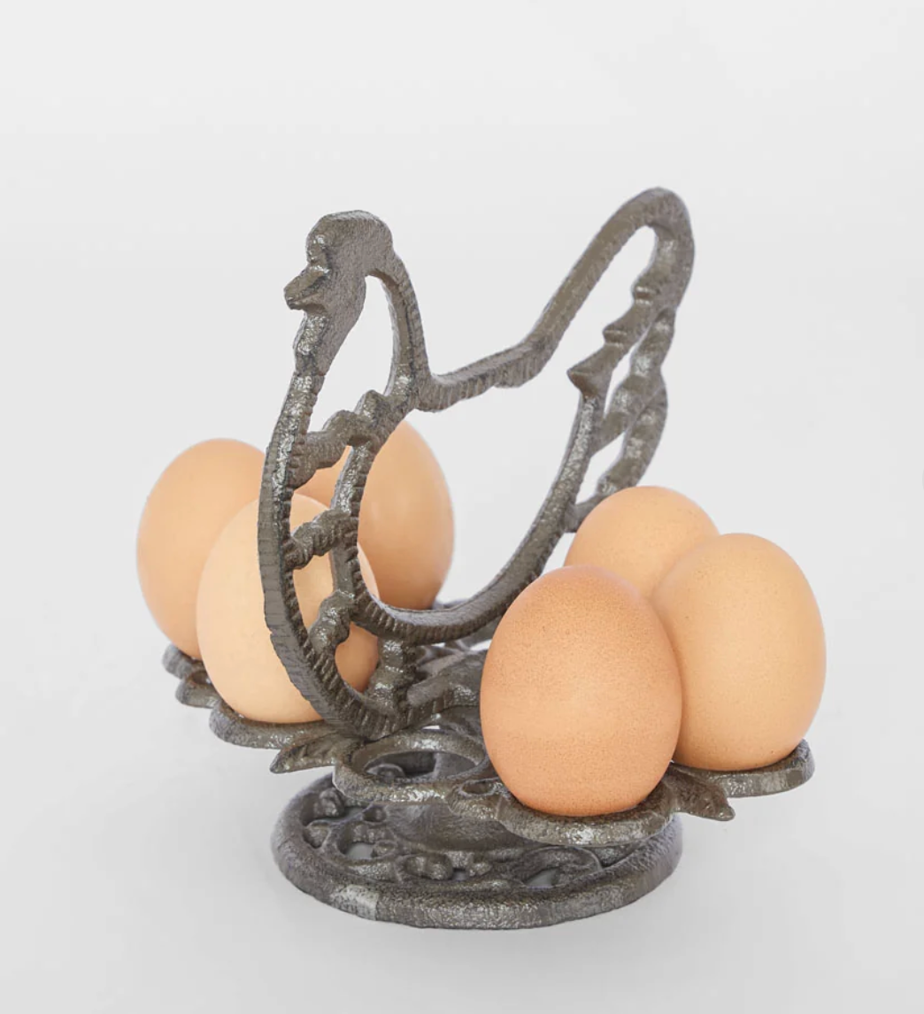 Cast iron chook egg holder without eggs, showing open circular holders