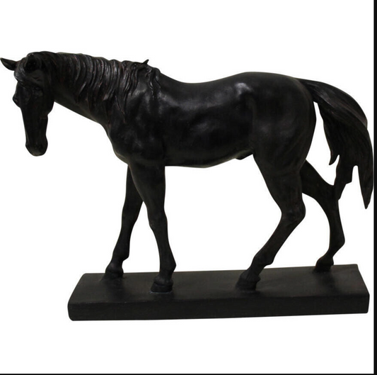 Black walking horse statue with a lowered head and detailed mane on an oblong base