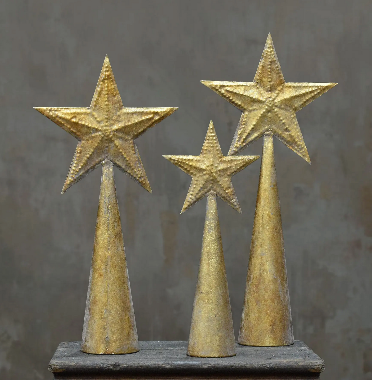 Close-up of the rustic weathered gold tapered base