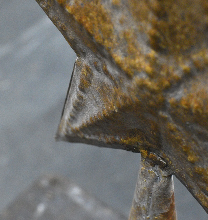 Set of three weathered gold tin stars on tapered bases