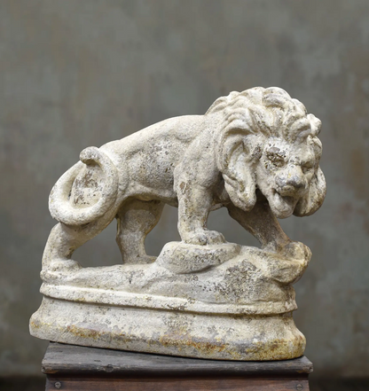 Sorel cement lion statue with a weathered stone finish, viewed from the front and side
