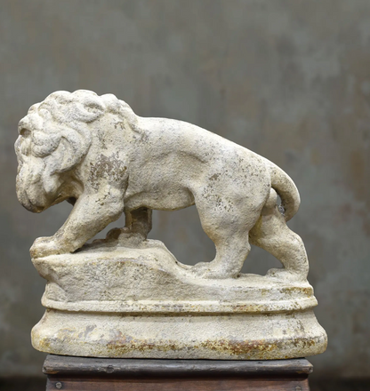 Opposite side of the lion statue showing its mane and standing pose
