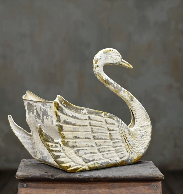Tin swan planter with a curved neck, raised feather detailing and an aged off-white and gold finish