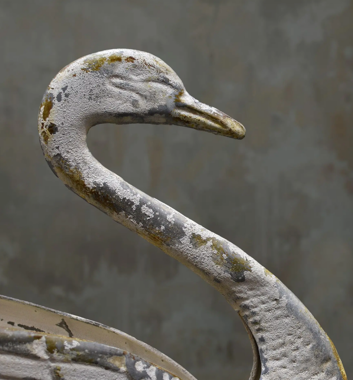 Close-up of the tin swan planter's head and curved neck