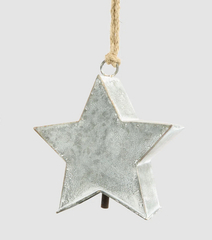 Close-up of zinc star decoration showing its dimensional shape and mottled finish