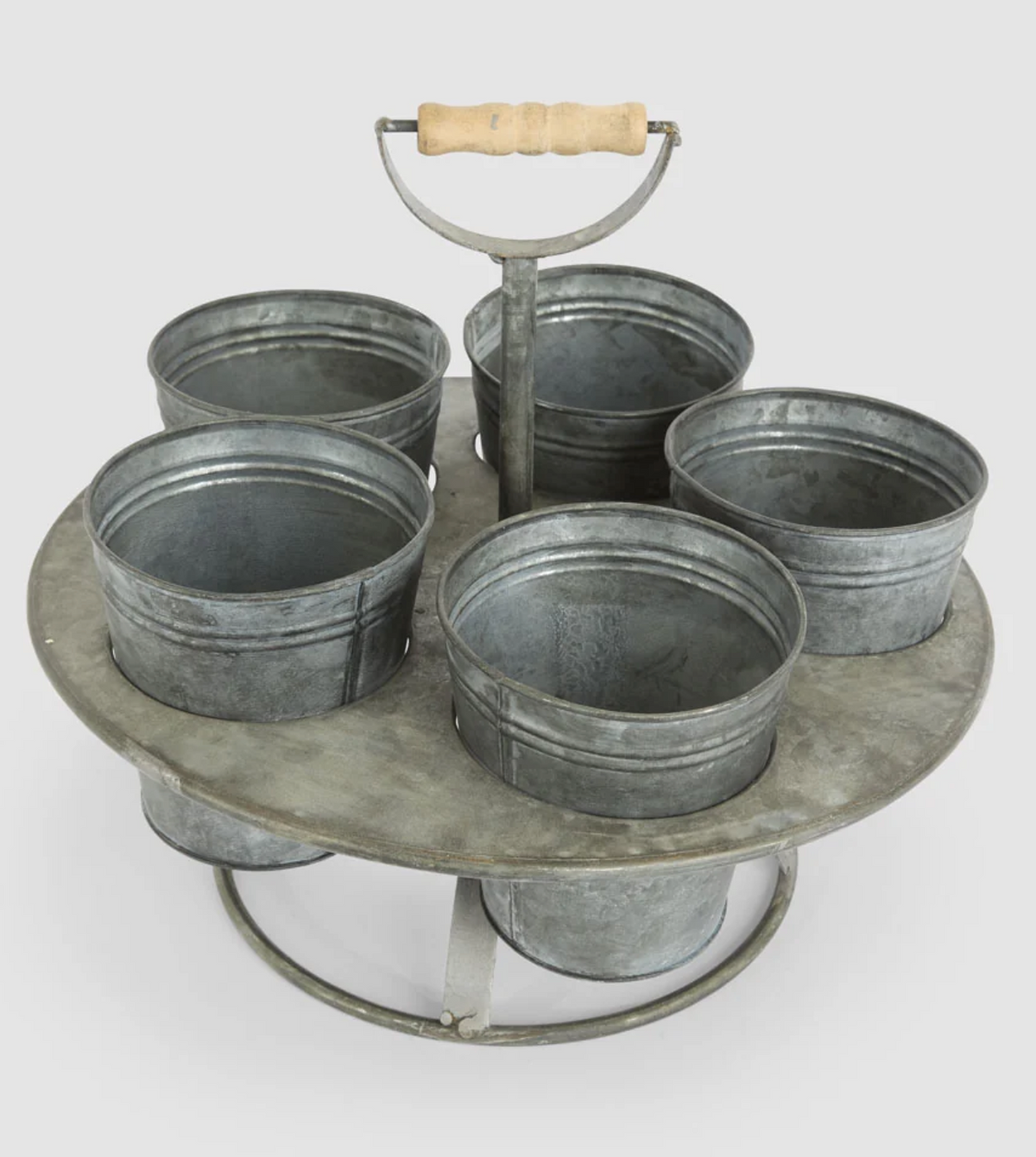 Zinc seedling holder with five pots in a circular stand and central carry handle