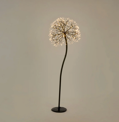 150cm dandelion floor light illuminated with warm white LEDs, curved black stem and circular base