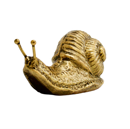 Gold-toned snail ornament with textured body and raised feelers, viewed from the front