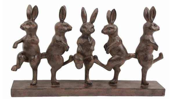 Five dark brown rabbits with raised legs and upright ears on a rectangular base.