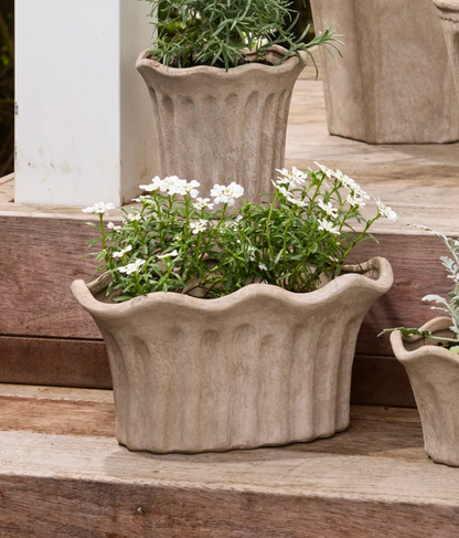 Close view of the sculpted fluted panels and rim of the Terra Fluted Oval Planter Large