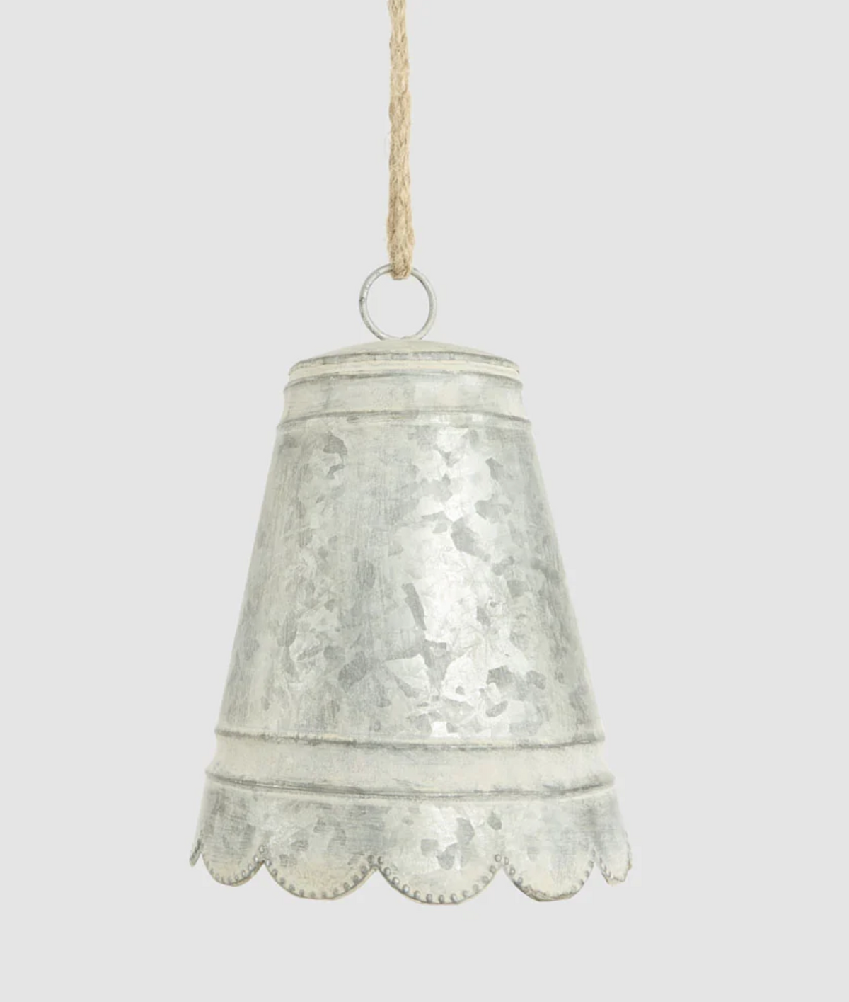 Small silver-grey zinc bell with scalloped edge and hanging cord