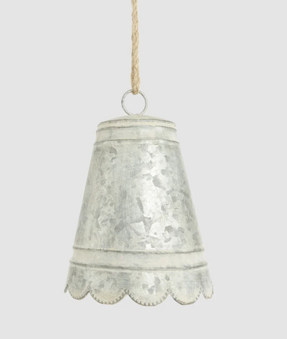 Small silver-grey zinc bell with scalloped edge and hanging cord